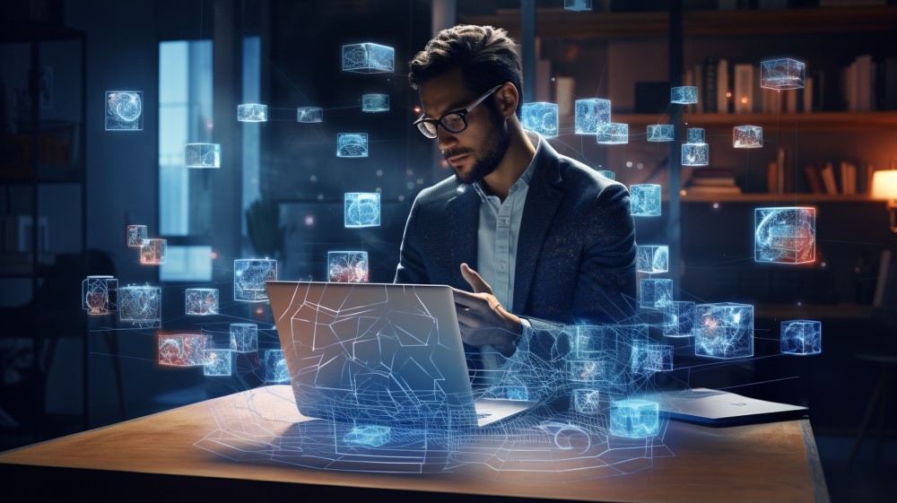 A man working on a laptop with digital icons displayed on the screen.